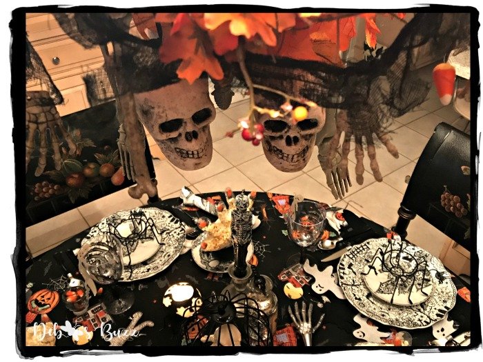 skeleton-feast-table-overhead-view-halloween-chandelier